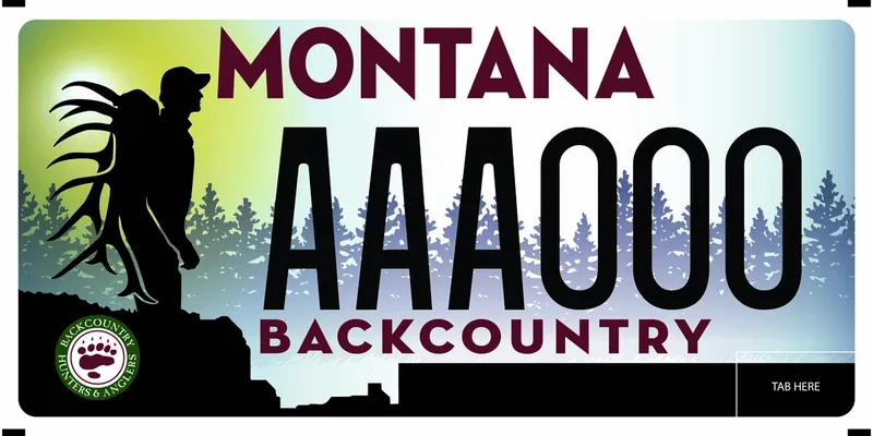 A license plate with black and maroon text. Silhouette of backpacker carrying antlers on left among trees. Text at bottom says Backcountry.
