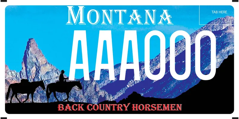 A license plate with white and red text. Photo of craggy mountain peaks and silhouette of cowboy on horse leading another horse. Text at bottom says Back Country Horsemen.