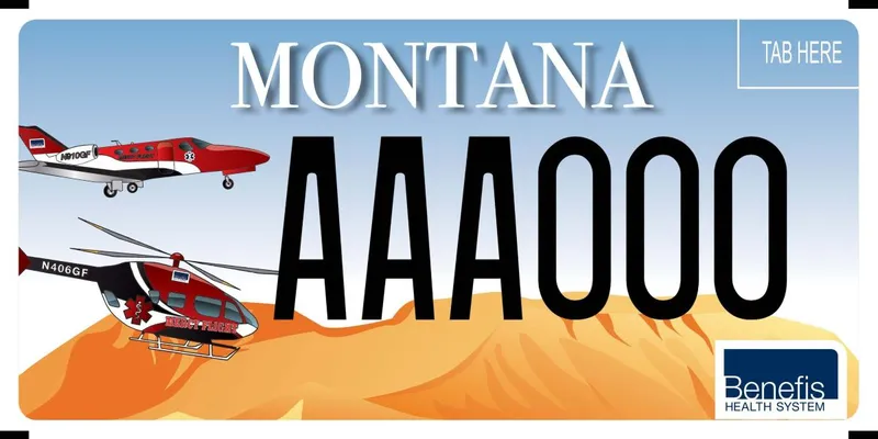 A license plate depicting blue sky at top and orange landscape on bottom. A rescue flight plane and helicopter are on left. Benefis Health System logo in bottom, right corner.