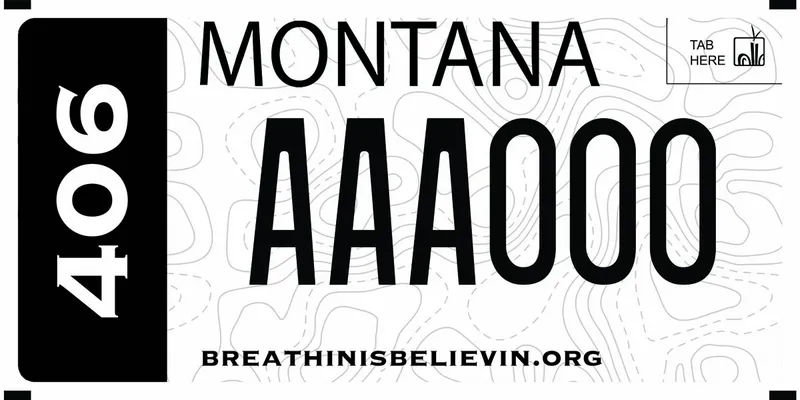 A black and white license plate with black and white text. Side says 406. Topography lines in background. Bottom text says Breathin Is Believin dot org.
