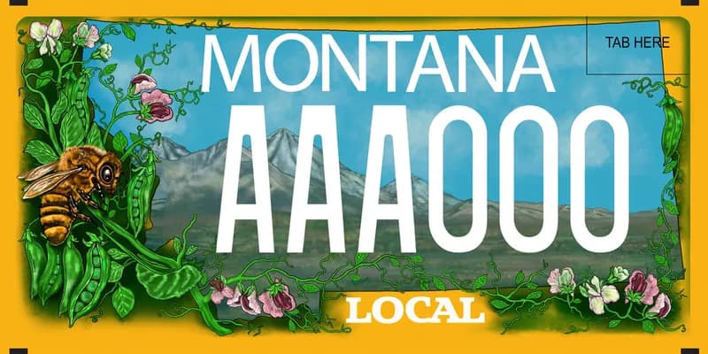 A license plate with white text. An illustration of peas, vines, pea flowers, and a honey bee. Mountains in distance. Bottom text says Local.