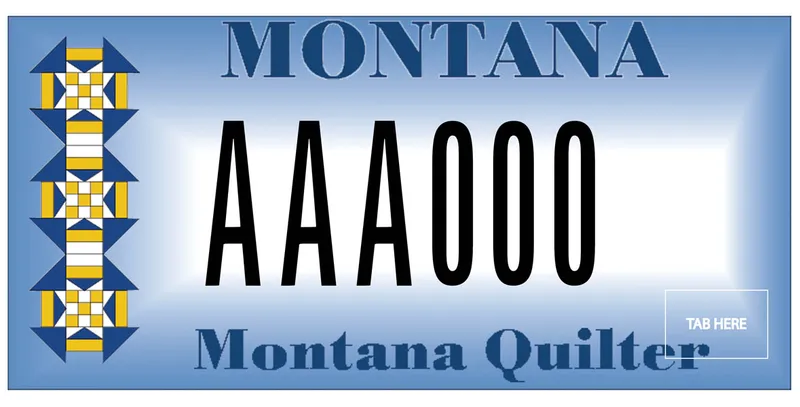 A light blue license plate with black and dark blue text. A quilt pattern is on left side. Bottom text says Montana Quilter.