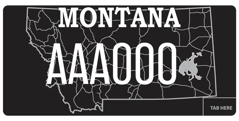 A black license plate with white text. A gray outline of the state and a gray silhouette of a bucking horse on right.
