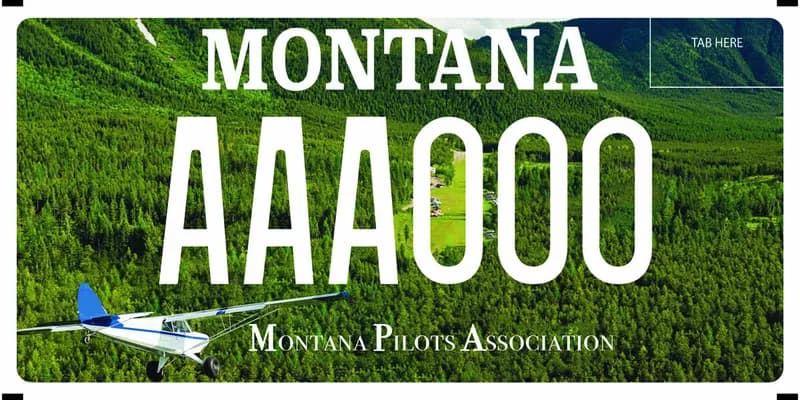 A license plate with white text with photography or a small plane flying over a pine tree covered landscape. Bottom says Montana Pilots Association.