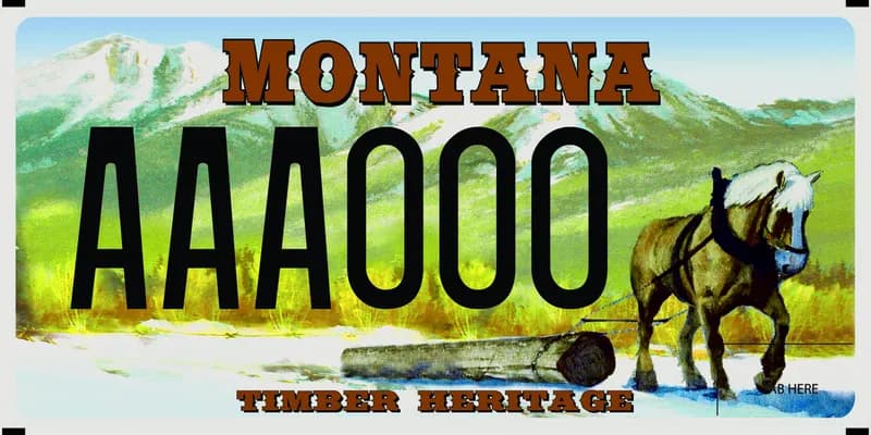 A licence plate with black and brown text. Illustrated scene of a draft horse pulling a log and mountains in distance. Bottom says Timber Heritage.