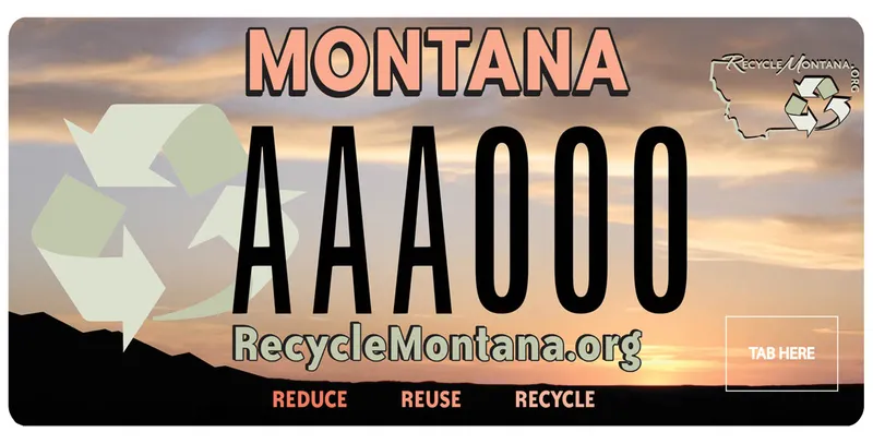A peach and black license plate. Black mountains at bottom and a cloudy peach sky. Recycle Montana logo in upper right corner. Recycle arrow icons at left. Below says Recycle Montana dot org and Reduce, reuse, recycle.